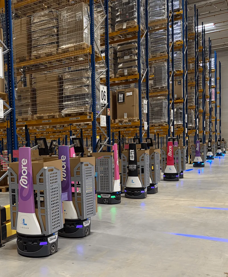 Robotic picking units moving through The Quality Group’s fulfillment centre.