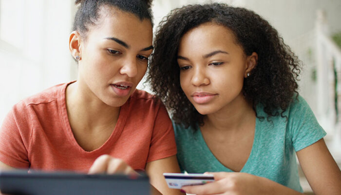 Two young women shopping at pure play retailers