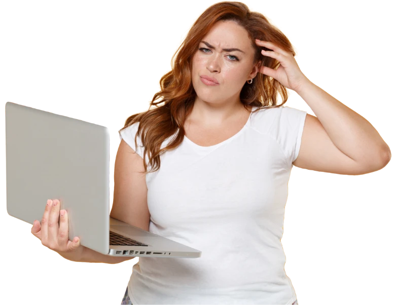 Woman looking at laptop confused